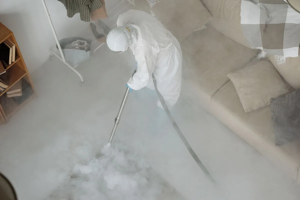 Biohazard cleanup technician in protective equipment, Willow, AK